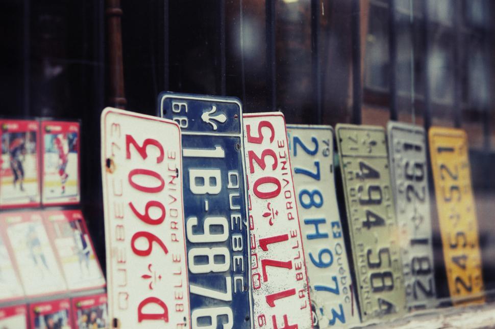 Free Image of Row of Street Signs Along Building 