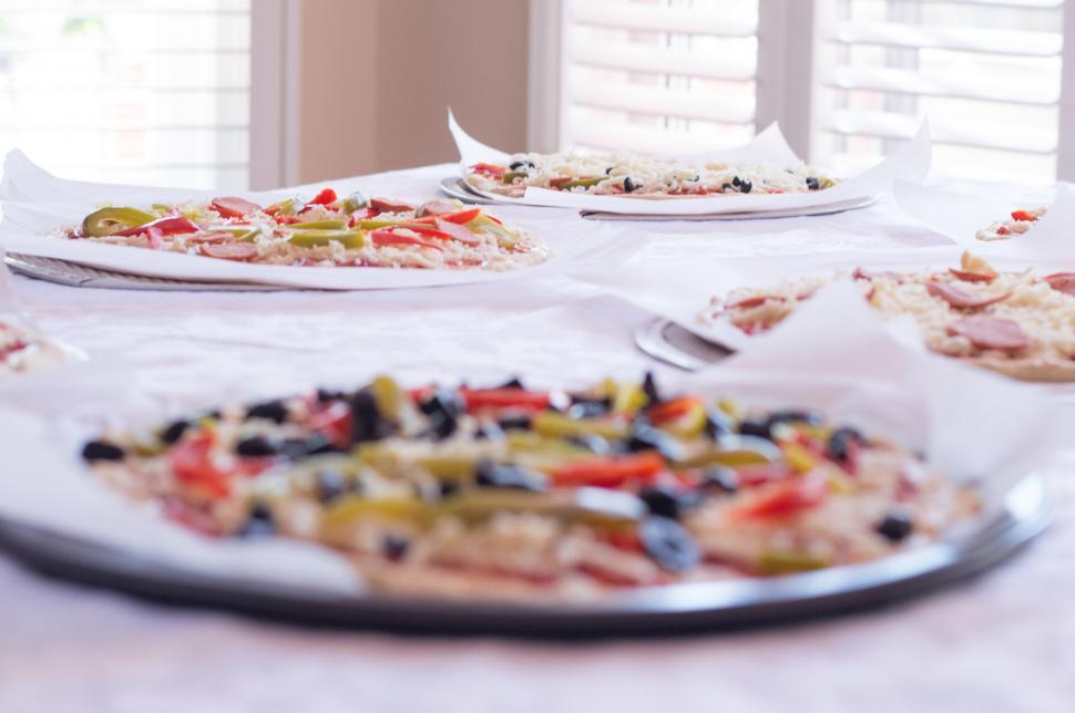 Free Image of Table Laden With Assorted Pizzas Toppings 
