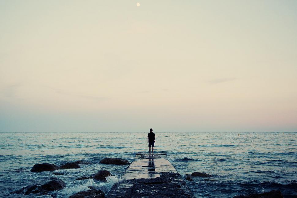 Free Image of Person Standing on Pier Looking at Ocean 