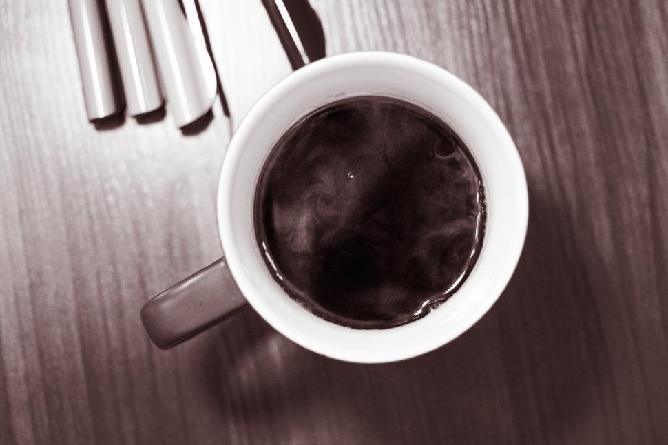 Free Image of Close Up of a Cup of Coffee on a Table 