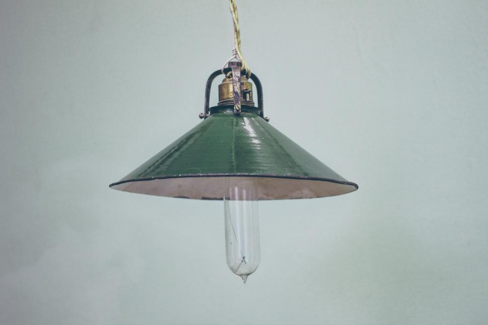 Free Image of Green Light Hanging From Ceiling 