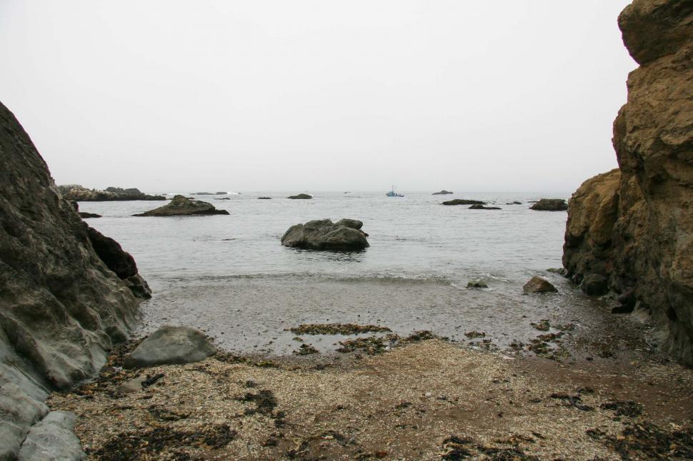 Free Image of beach fort bragg california rocky shore ocean sand wave rocks sea shoreline coast coastal pacific glass boat fog foggy danger cliff cliffs 