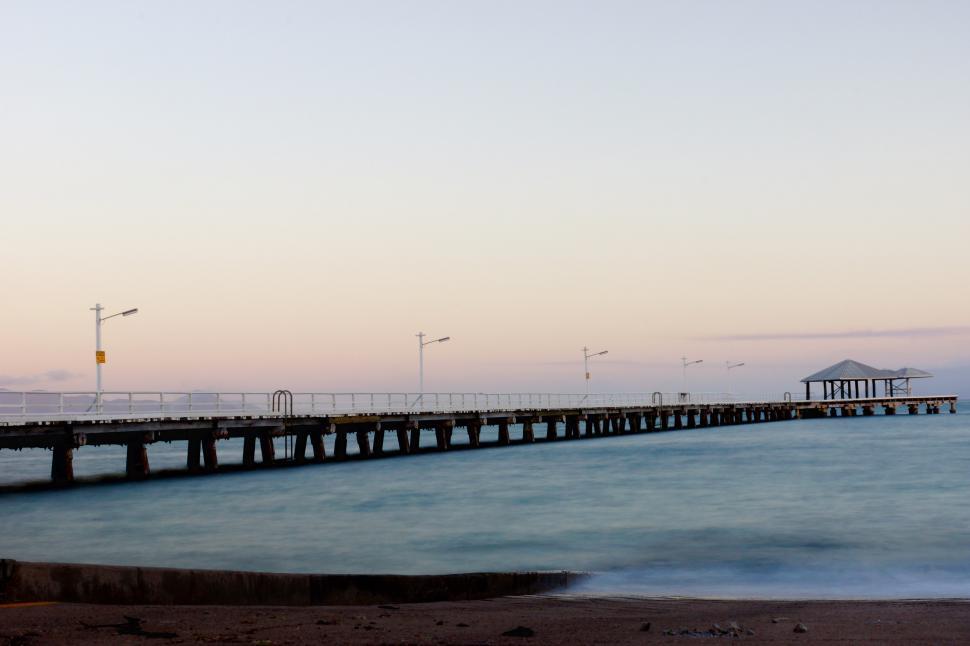 Free Image of Long Pier Extending Into the Ocean 