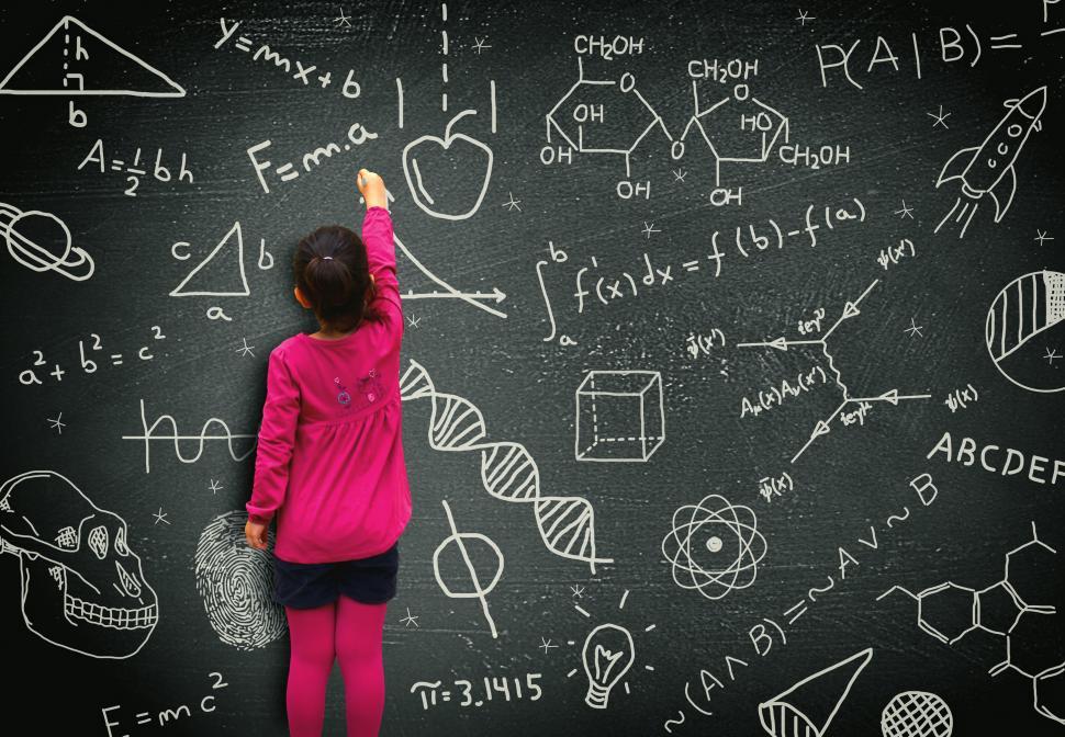 Download Free Stock Photo of Little girl writing on blackboard - Learning and knowledge conce 