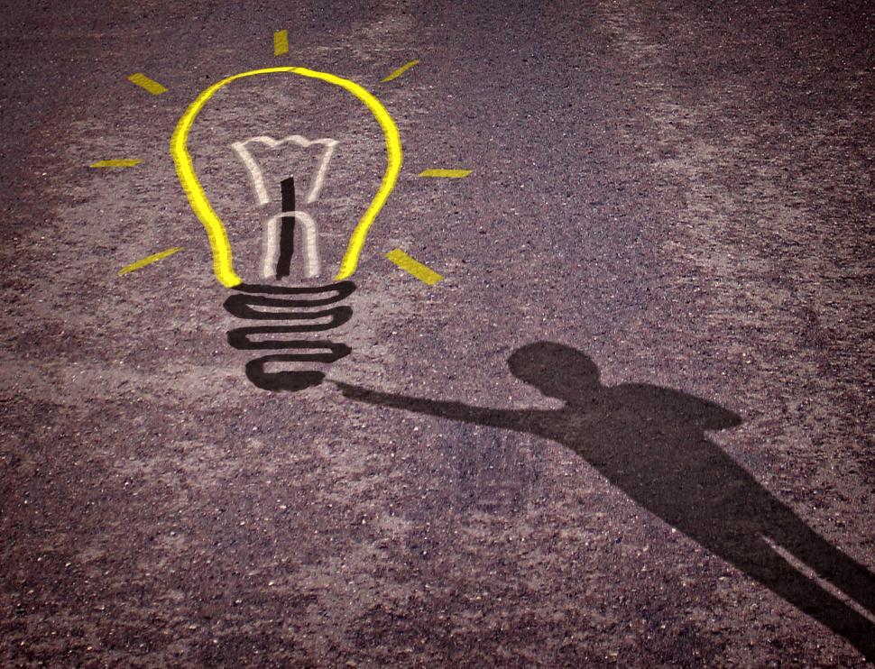 Free Image of Shadow of a boy touching a lightbulb drawing - Child creativity  