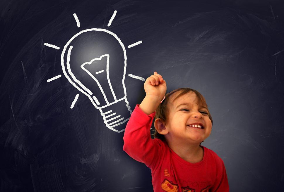 Download Free Stock Photo of Little cute girl having a good idea on the blackboard - Learning 