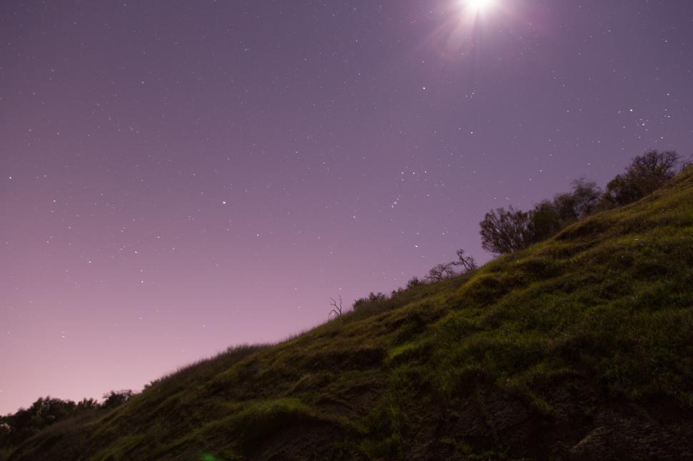 Free Image of Star-Filled Night Sky Above Hill 