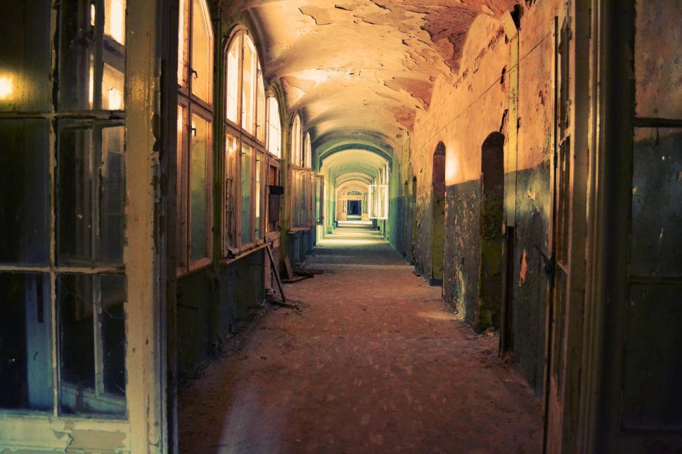 Free Image of Long Hallway With Multiple Windows 