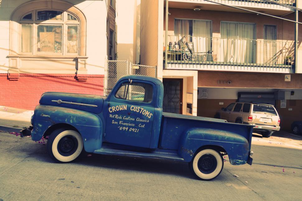 Free Image of Old Blue Truck Parked on Side of Road 