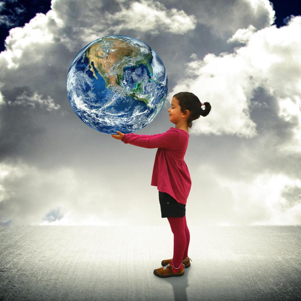 Download Free Stock Photo of Child holding the world in her hands 