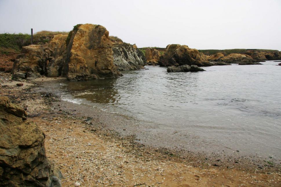 Free Image of beach fort bragg california rocky shore ocean sand wave rocks sea shoreline coast coastal pacific glass cove fog foggy landfill garbage trash 