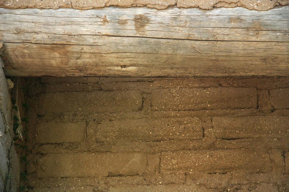 Free Image of adobe header beam brick mortar log wood mud wall background texture 