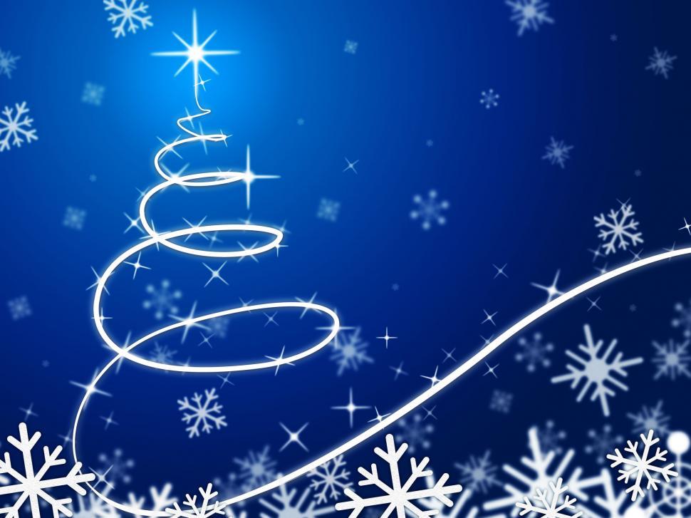 Free Image of Blue Christmas Tree Background Means Snow Flakes And December  
