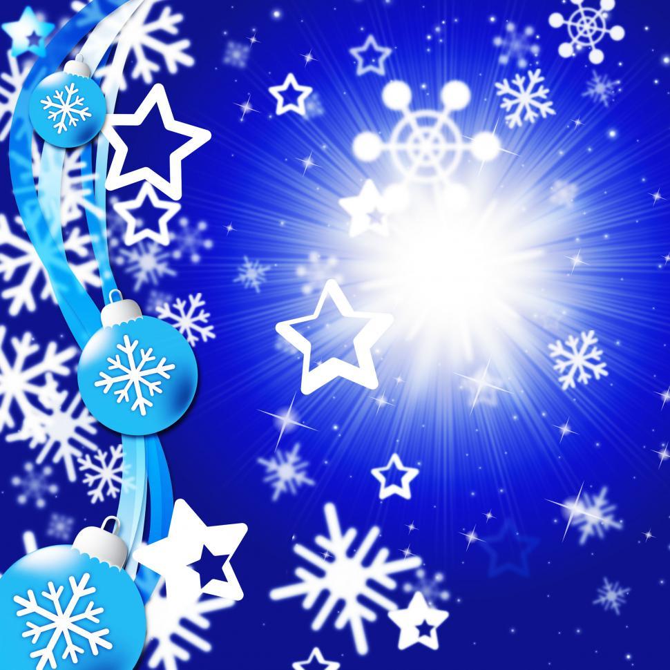 Free Image of Blue Snowflakes Background Shows Bright Sun And Snowing  