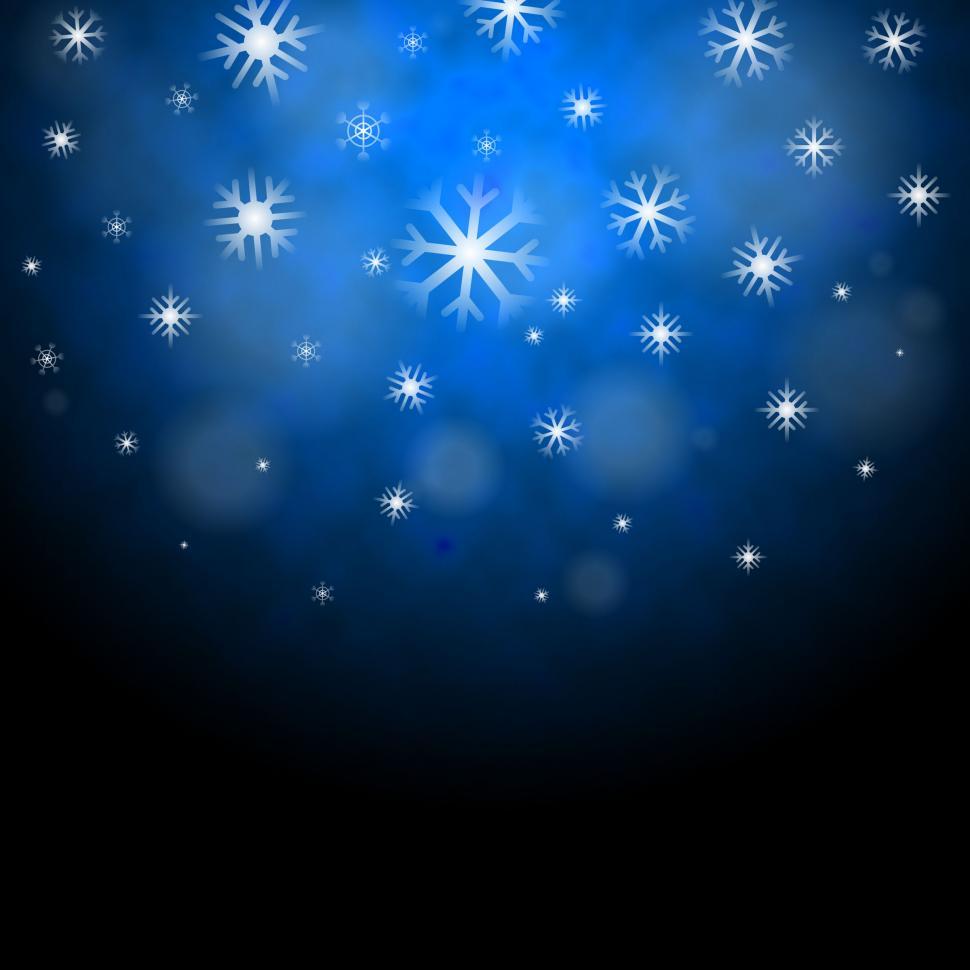 Free Image of Snowflakes Blue Background Shows Frozen Shiny Stars  