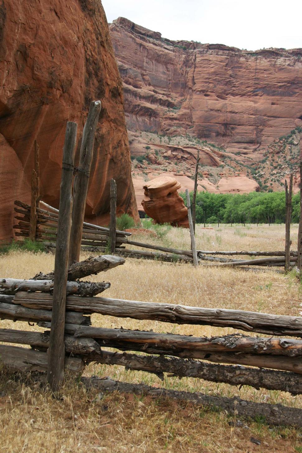 Free Image of cliff cliffs canyon de chelly chelly canyon de arizona indian native american monument national navajo southwest log rail fence corral grass dried weeds post ranch 