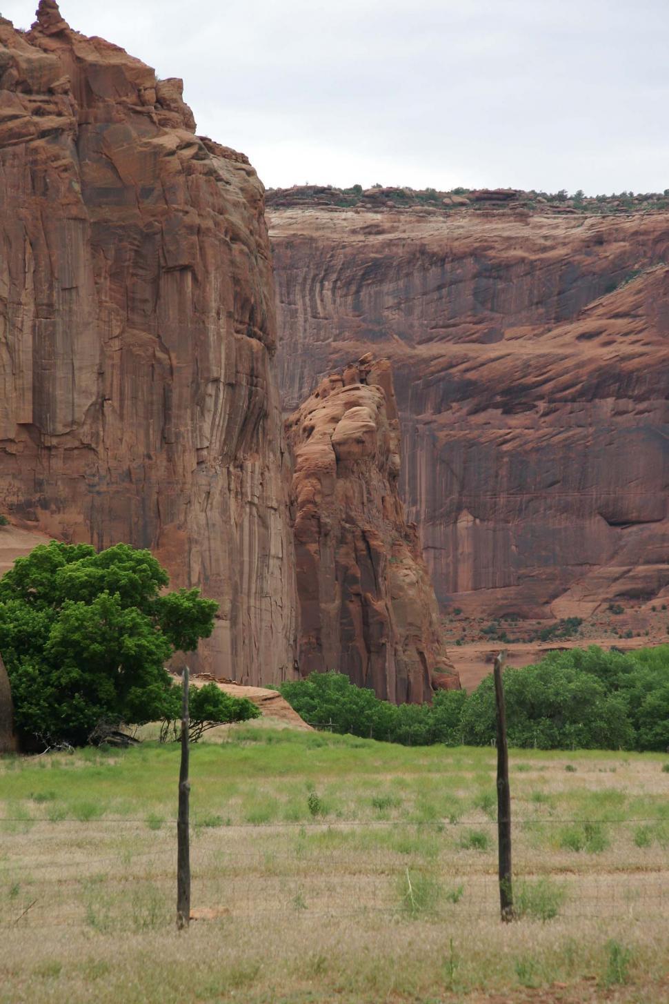 Free Image of cliff cliffs canyon de chelly chelly canyon de arizona indian native american monument national navajo southwest field grasslands pasture fence barbed wire floor 