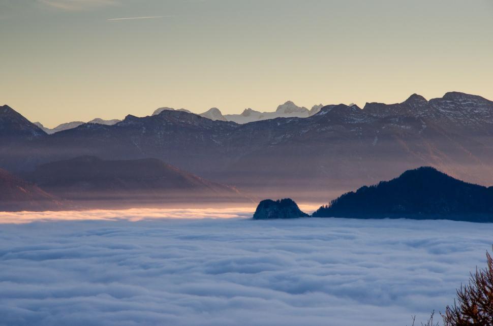 Free Image of Majestic Mountain Range Above Clouds 