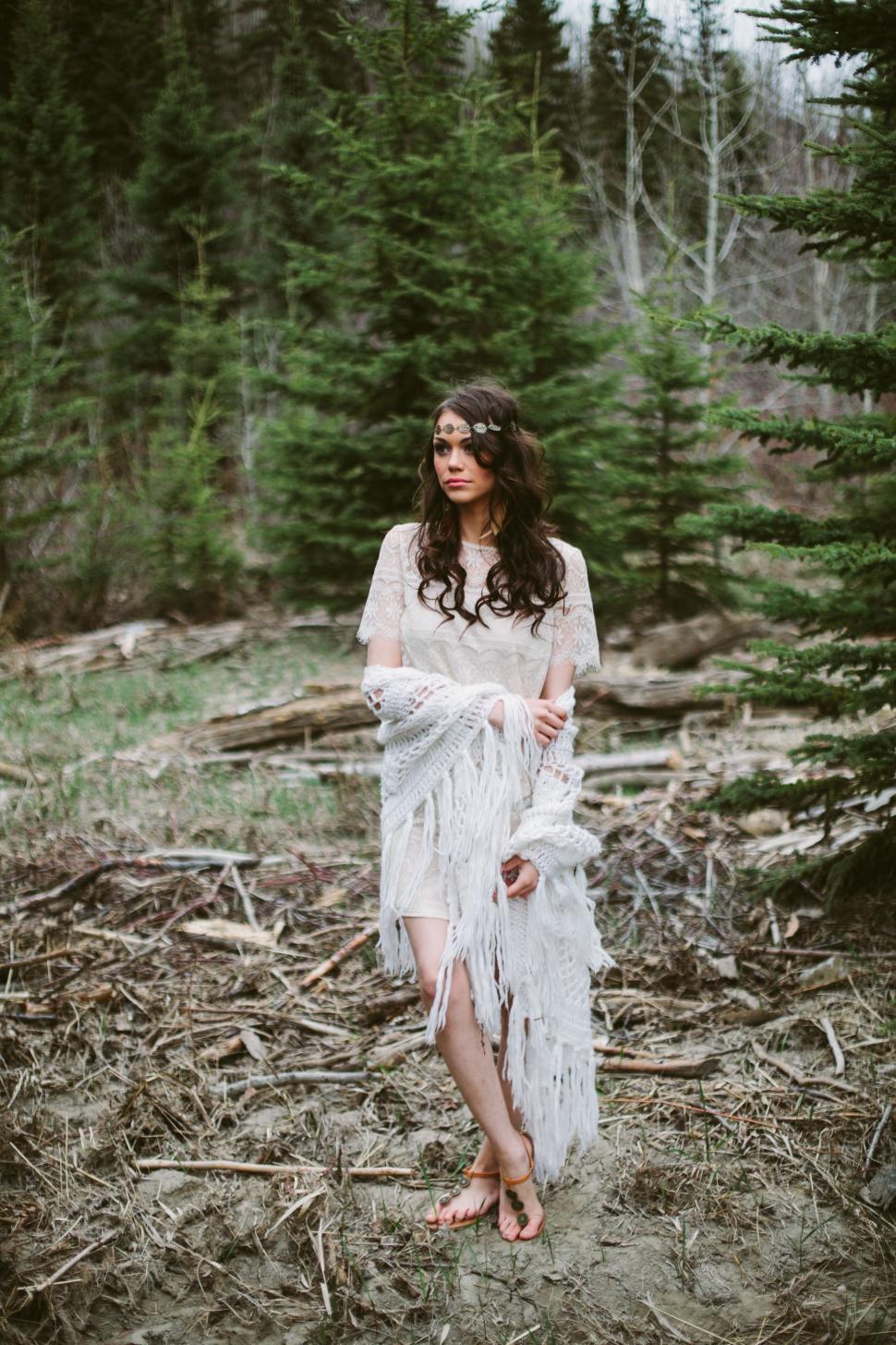 Free Image of Woman in White Dress Standing in Forest 