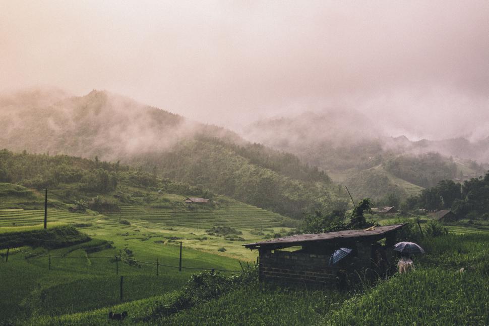 Free Image of Small Hut Amid Lush Green Valley 