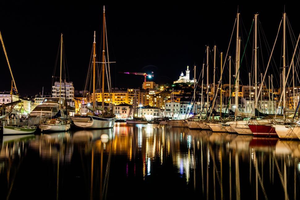 Free Image of Boats Filling a Harbor at Night 