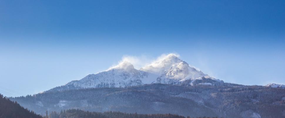 Free Image of Majestic Snow-Covered Mountain Under Blue Sky 