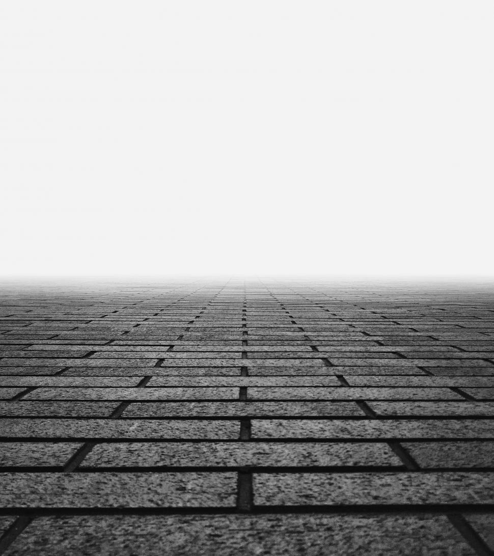 Free Image of Black and White Photo of a Brick Floor 