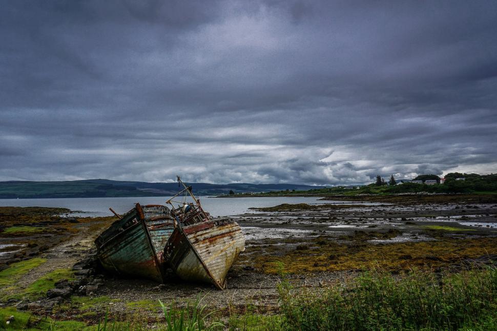 Free Image of Two Boats Resting on Grass Field 