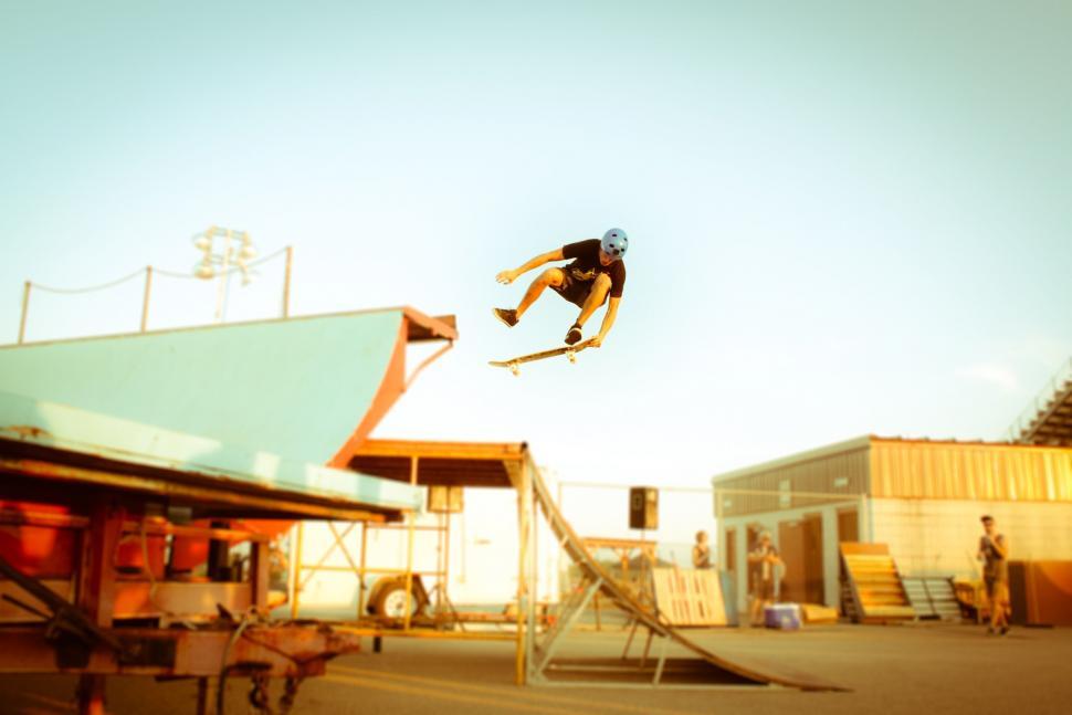 Free Image of Man Flying Through the Air on Skateboard 