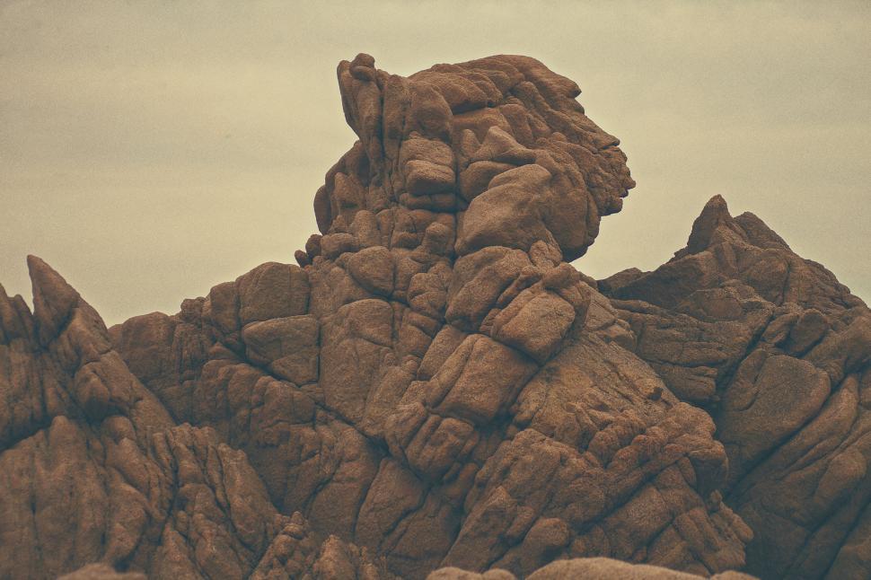 Free Image of Rock Formation Rising in Desert Landscape 
