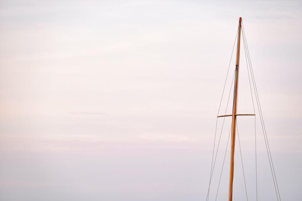 Free Image of Sailboat Sailing on Water Under Cloudy Sky 