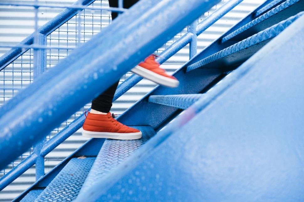 Free Image of Person Standing on Blue Staircase 