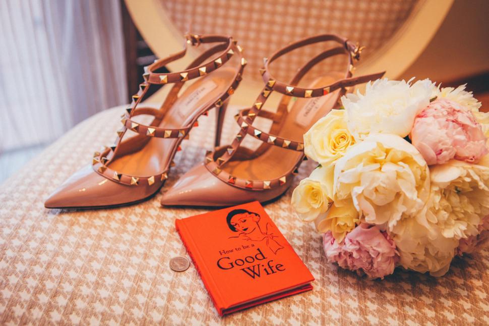 Free Image of Bouquet of Flowers Beside Pair of Shoes 
