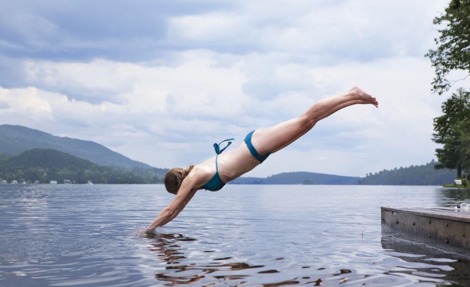 Free Image of Man Diving Into Body of Water 