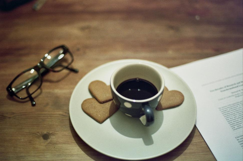 Free Image of A Cup of Coffee and Glasses on Saucer 