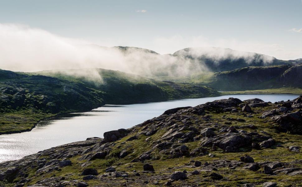 Free Image of Mountain-Encircled Lake Amidst Clouds 