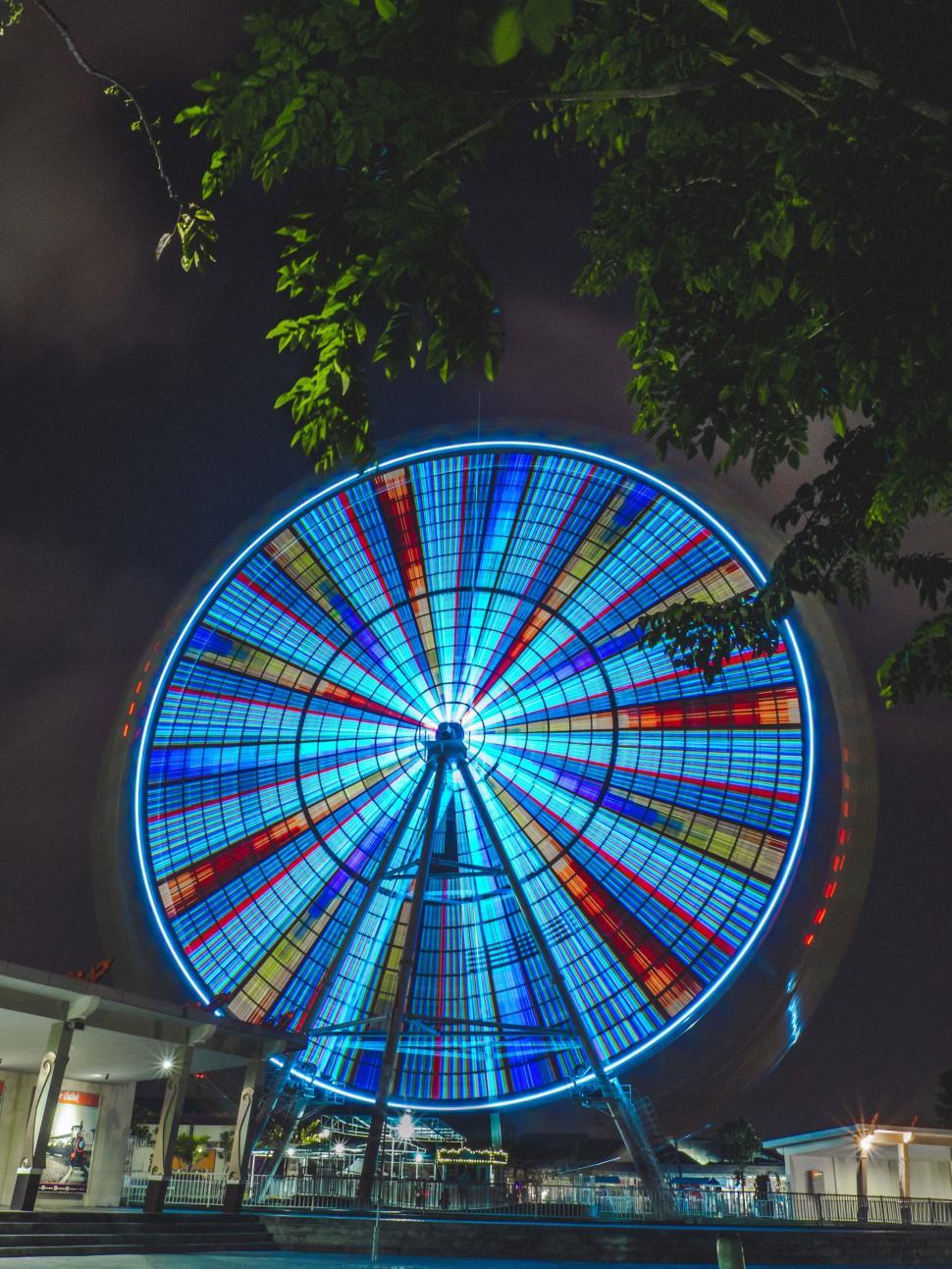 Free Image of Illuminated Ferris Wheel Glowing in the Night Sky 