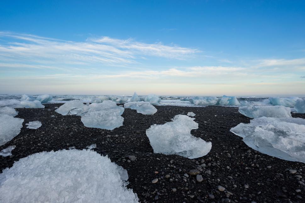 Free Image of Large Amount of Ice Floating on Body of Water 