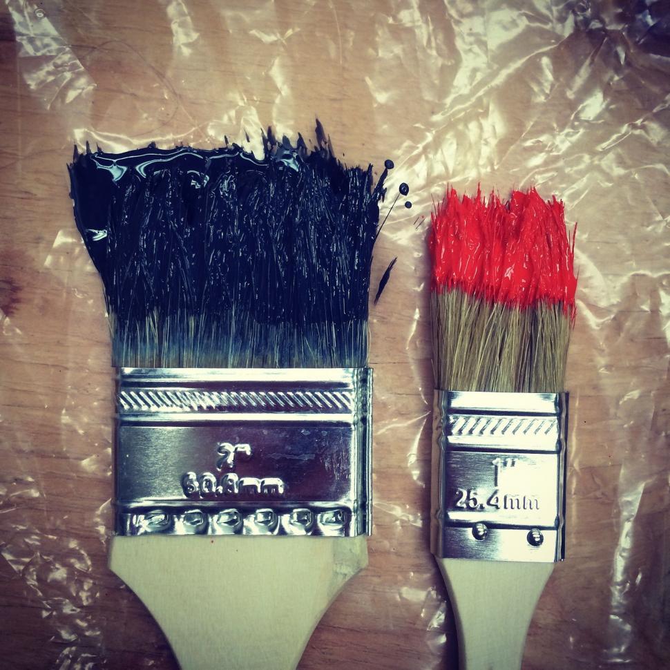 Free Image of Two Paint Brushes on Wooden Table 