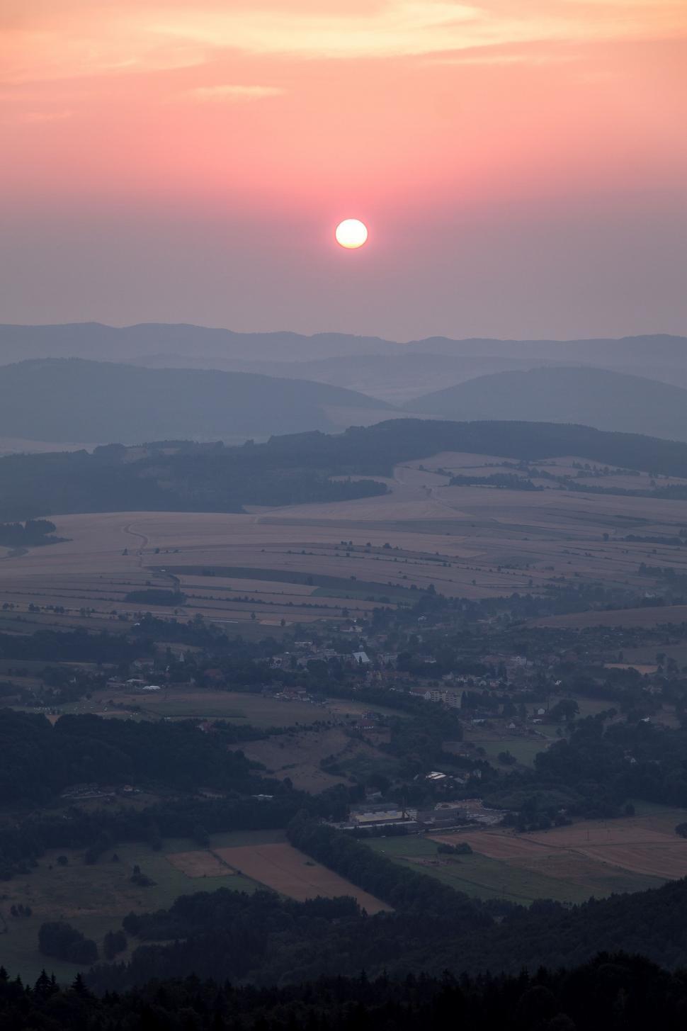 Free Image of Sunset Casting Warm Glow Over Valley 