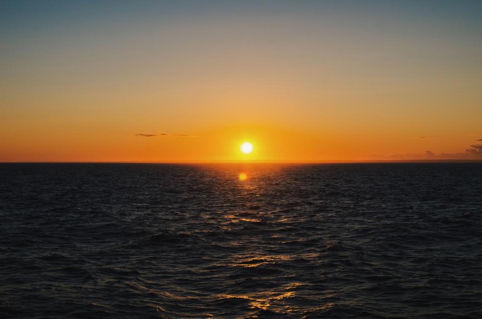 Free Image of Sun Setting Over Ocean From Boat 