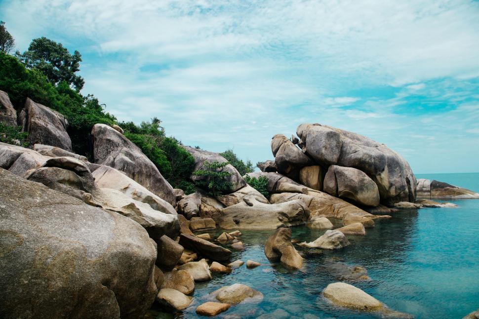 Free Image of Body of Water Surrounded by Large Rocks 