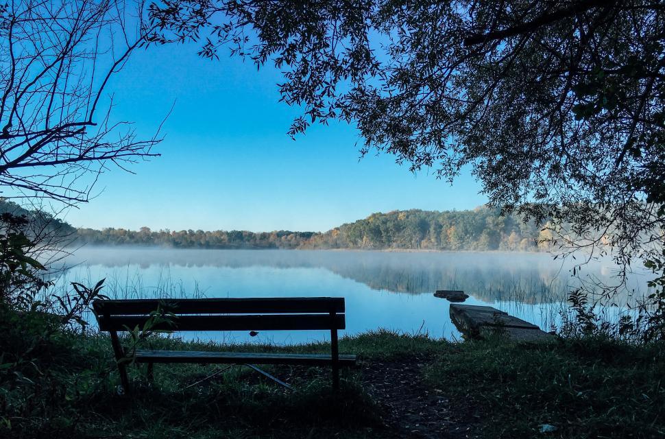 Free Image of A Bench by a Water Body 
