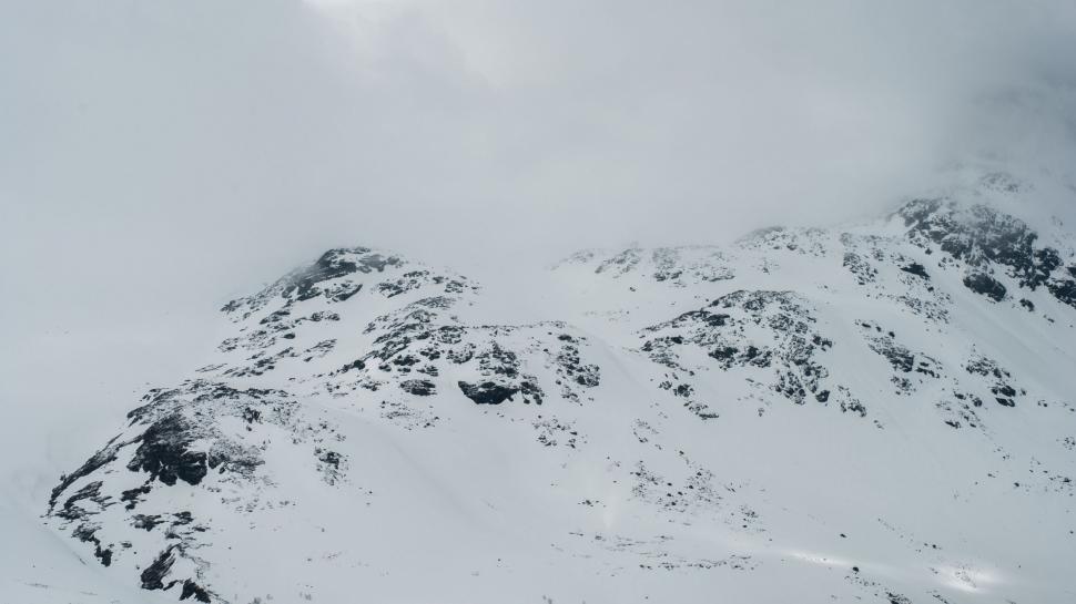 Free Image of Snow-Covered Mountain Under Sky 