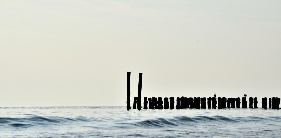 Free Image of Pier Next to Large Body of Water 