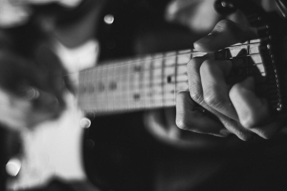 Free Image of Close Up of Person Playing Guitar 
