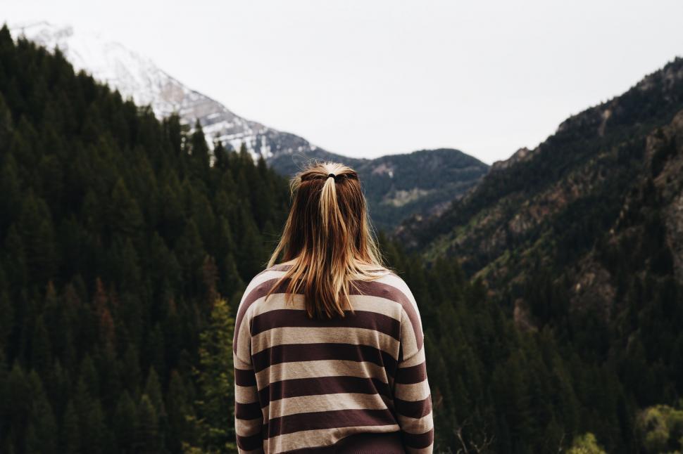 Free Image of Woman Standing in Front of Mountain 