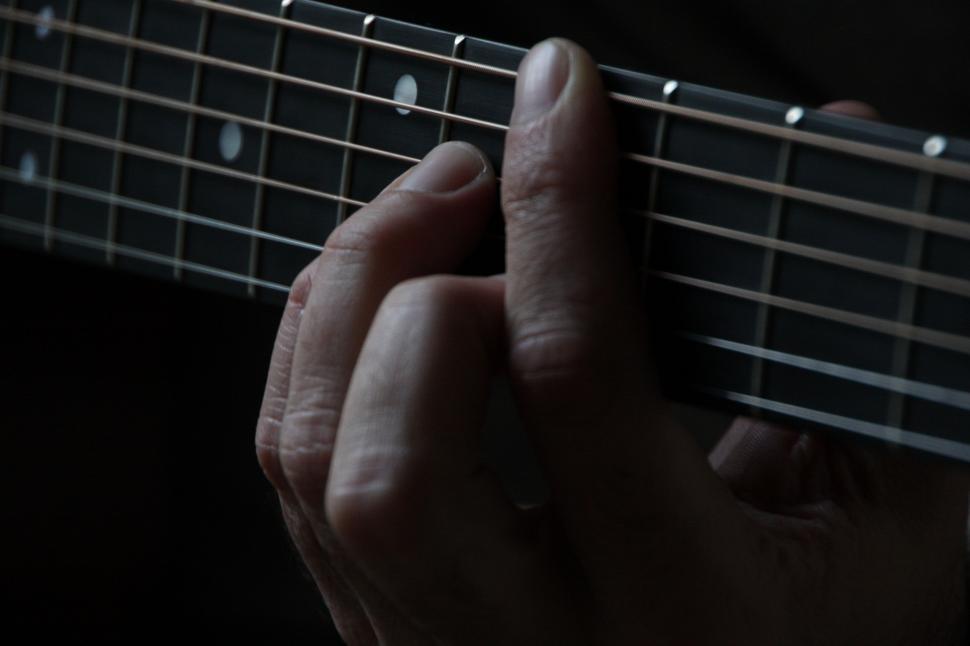 Free Image of Person Playing Guitar With Fingers 