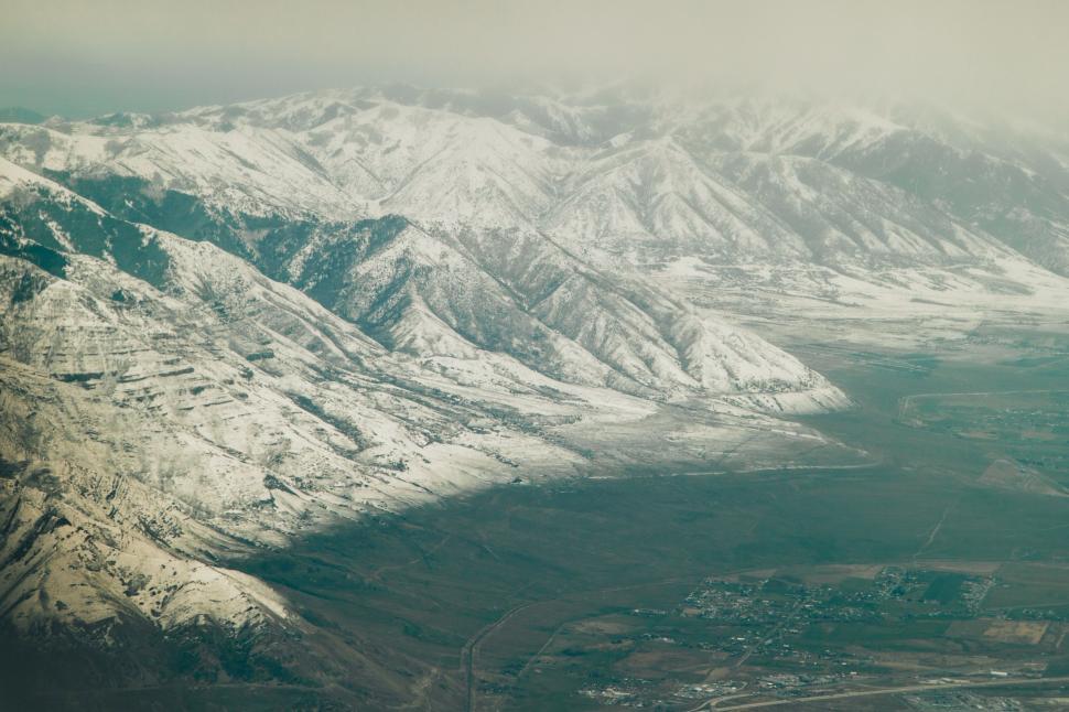 Free Image of A View of a Snowy Mountain Range From an Airplane 
