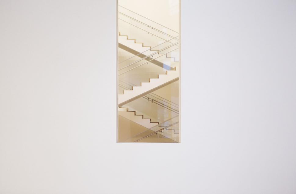 Free Image of White Wall With Hanging Staircase 
